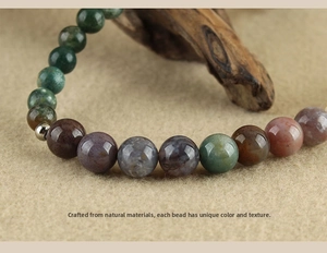 Macro detail of natural agate stone beads wrist strap with unique textures and silver spacer