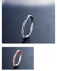 Detail of minimalist S925 silver and rose gold rings with pavé set cubic zirconia