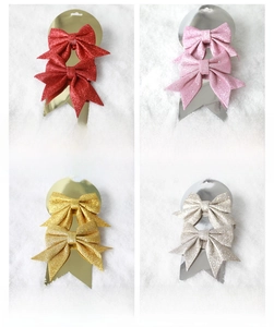 Set of four glittering Christmas tree bows in red, pink, gold and champagne tones