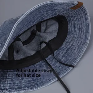 Detail of adjustable drawstring inside washed denim bucket hat for custom head fit