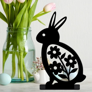 Detail of black hollow floral pattern on rabbit ornament for Easter tabletop decor