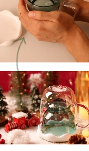 Close-up of a double-walled Christmas tree glass with white snowflake patterns