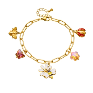 Detail of golden charm bracelet featuring colorful enamel bees, ladybugs and flower charms