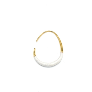 Detail of minimalist U-shaped gold earrings with polished white enamel inlay texture