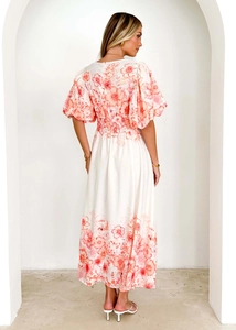 Detail view of the floral maxi dress featuring a high elastic waist and back zipper closure