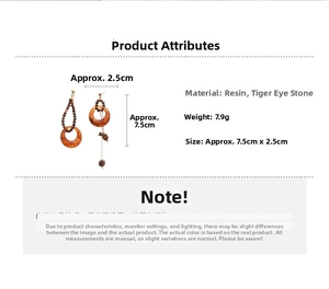 Detail view of asymmetric resin and tiger eye earrings with 7.5cm size measurement