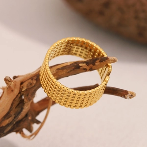 18K gold plated mesh open ring with honeycomb texture on a natural branch display