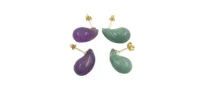 Close-up of teardrop amethyst and green moonstone stud earrings with gold posts