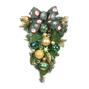Green PVC Christmas teardrop swag with gold ornaments and Santa print ribbon bow