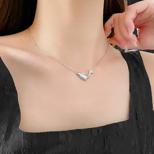 Minimalist silver whale pendant necklace featuring a sleek zircon finish for women