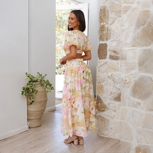 Elegant floral print two-piece summer dress set featuring crop top and high-waisted maxi skirt