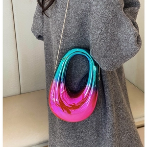 Iridescent acrylic oval clutch bag with blue purple gradient and thin metal chain strap