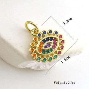 Macro detail of rainbow zircon evil eye pendant with dimensions 1.2cm and 0.8g weight
