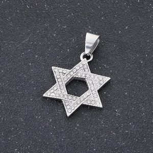 Macro shot of silver hip-hop hexagram pendant with iced out crystals and smooth metal bail