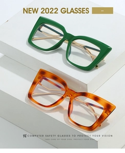 Detail view of stylish square cat eye computer glasses in green and tortoise shell colors