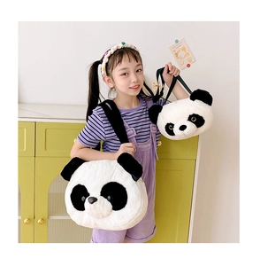 Detail of two plush panda head bags in black and white faux fur with a soft texture