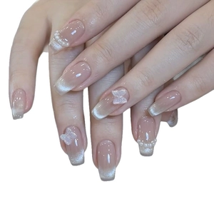 Elegant cat-eye press-on nails with 3D butterfly charms and pearls in medium-long length