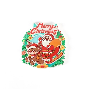Christmas fridge magnet set with Santa on a sleigh, reindeer and festive wreath decor