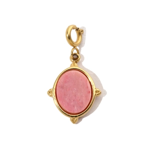 Detail of pink natural stone pendant with gold stainless steel frame and clasp