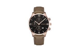 Detail of rose gold men's watch with brown leather strap and black calendar dial