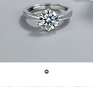 Macro shot of a silver ring with a six-prong round cubic zirconia and small side stones