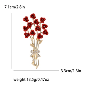 Elegant gold rose bouquet brooch with 11 red flowers and a rhinestone bow ornament