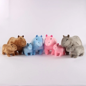 Capybara plush toys in various sizes and colors including brown, blue, pink, and grey