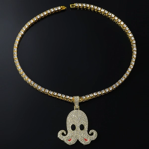 Close-up of a gold-plated octopus pendant with full diamond setting and a 5mm tennis chain
