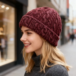 Detailed cable knit pattern on burgundy winter beanie with thick ribbed cuff texture