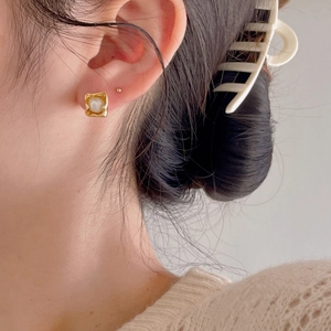 Elegant gold square pearl stud earrings for women featuring a minimalist brushed finish