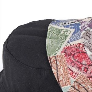 Detailed view of retro stamp pattern stitching and fabric texture on a bucket hat