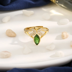 Chic gold angel butterfly ring with olive green teardrop gem and sparkling crystals