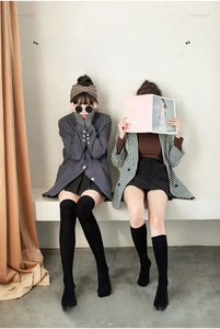 Detail view of high elastic compression over-knee socks in black, white and gray options