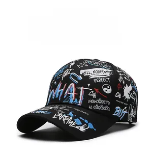 Close-up of black hip-hop baseball cap with blue and white graffiti print details