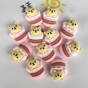 Flat back resin charms featuring cute yellow cats in pink cupcakes for DIY crafts