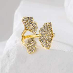 Luxurious 18K gold plated ginkgo leaf open ring with sparkling zircon stones on a stone base