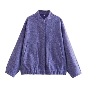 Detailed close-up of purple tweed texture and stand collar on the casual jacket