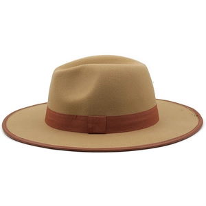 Detail of khaki wide brim fedora hat showing textured wool fabric and brown grosgrain band
