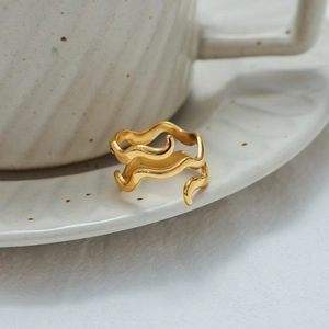 Elegant gold minimalist stainless steel ring with a layered wavy curved design
