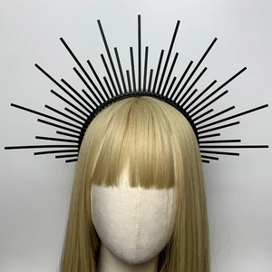 Detailed front view of black spiked halo crown headpiece with radiant sunburst design