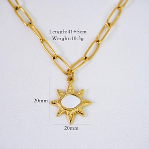 Detail of 14K gold plated paperclip chain with sunburst pendant and white shell inlay