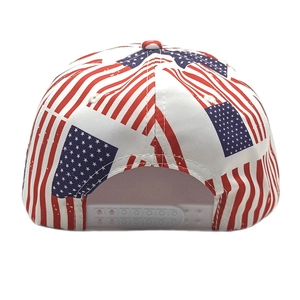 Detail of adjustable white snapback closure on a flat brim cap with US flag print