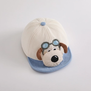 Detail of baby corduroy baseball cap with cute 3D cartoon dog and blue aviator goggles
