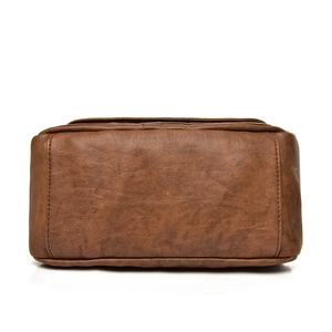 Brown litchi grain leather shoulder bag featuring a durable rectangular base design