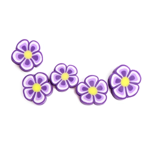 Detailed macro view of 10mm purple plum flower polymer clay beads for DIY jewelry