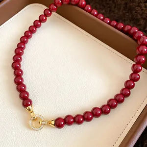 Red zircon beaded pendant necklace with a gold-plated circle clasp in vintage style