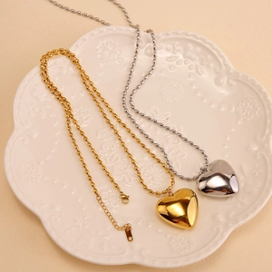 Modern heart pendant necklaces in gold and silver finish with elegant bead chains