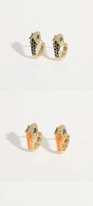 Detail of snake head hoop earrings with colorful enamel scales and green gemstone eyes