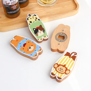 Cartoon animal wooden magnetic bottle opener set on a rustic wooden tray background