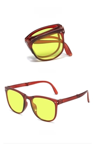 Foldable anti-UV sunglasses featuring dark tea frames with yellow lenses and compact design